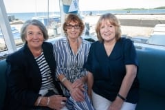 From left, Renee Watson, Evie Donaldson and Dorothy Wyness who enjoyed the commodore's reception on Saturday. P30-27-06-19